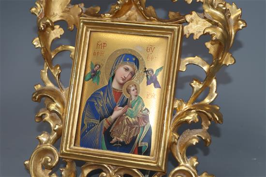 A Continental porcelain icon depicting Madonna and Child, in a Florentine frame